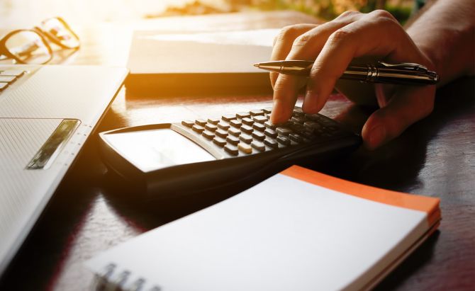 Man calculating for tax depreciation report