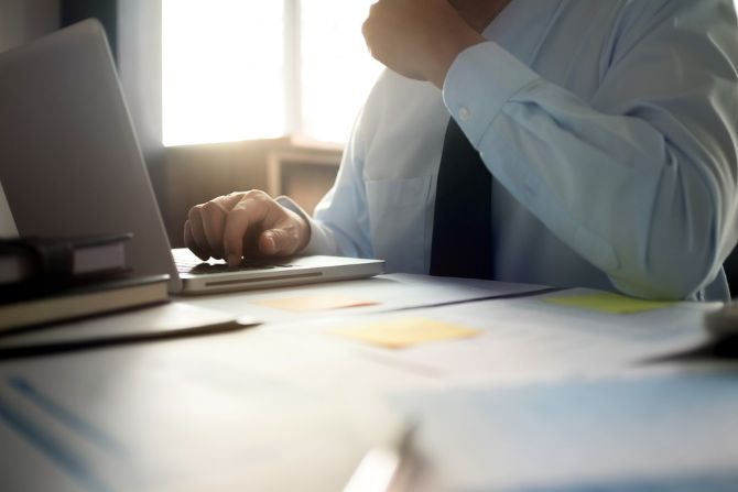 Man working on tax depreciation report
